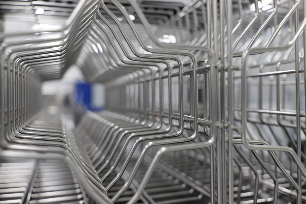 An industrial photography of a metal grille, the back is blurry