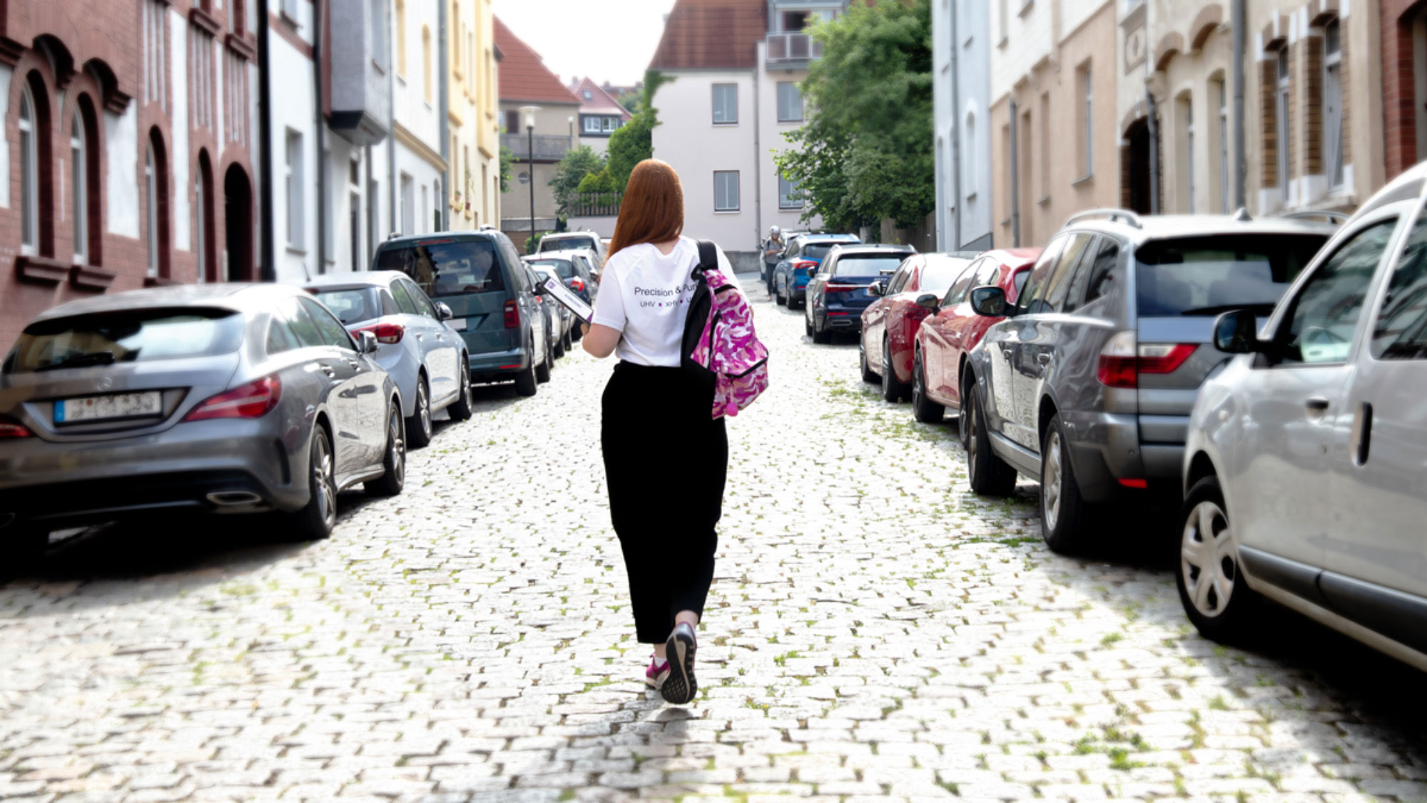 Photography of a person walking down a road